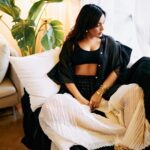Neha Sharma Instagram - Another day, another slay… 👣🤍🖤 . . . Photography: @leroifoto Styling: @aeshah Shirt, trousers: @urvashikaur Top: @massimodutti Bracelets, rings: @myrhabyrhea Hair : @tejisinghofficial
