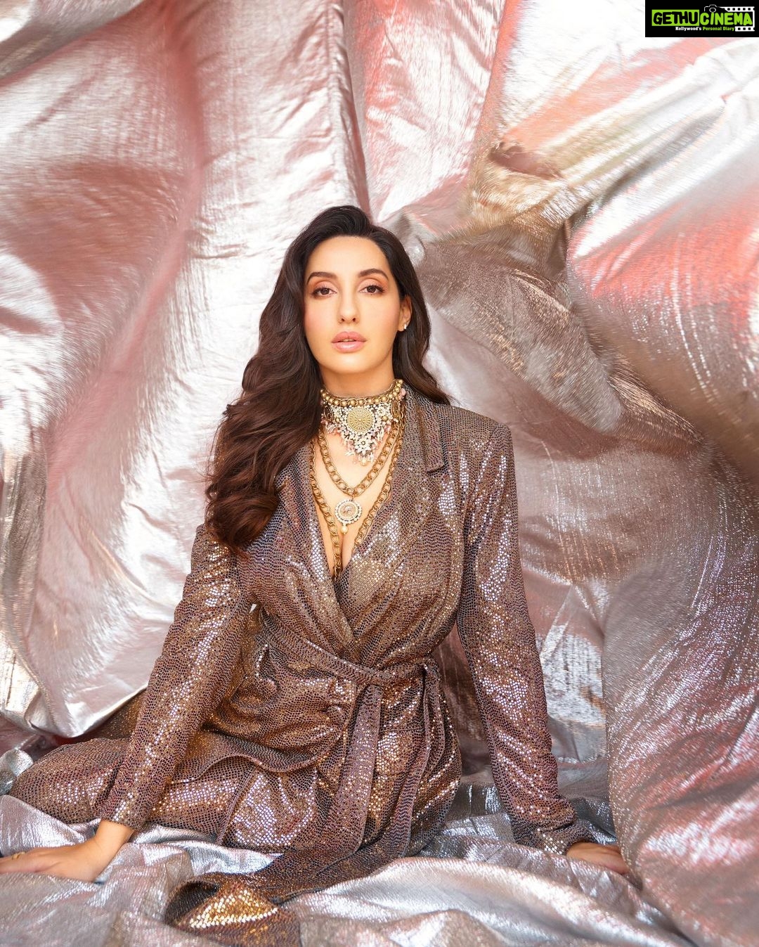 Nora Fatehi Instagram - Somebody plz tell him who the eff I is.. i mack them dudes up, back coupes up, and chuck the deuce up ..π Outfit by : @elilhaam Γ @badgleymischka Neckpiece by : @rockystarofficial Styled by : @manekaharisinghani Makeup by : @reshmaamerchant Hair by : @souravroy_1999 Shot by : @tejasnerurkarr