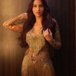 Nora Fatehi Instagram - Like my #MyGoldenMove? Share yours and get a chance to be a part of the Altroz - #TheGoldStandard experience in Goa on 19th December! See below to know how you can be a part of this #ExclusiveAltrozExperience! . . . Click-Share-Win in two simple steps: Step 1 – Click our #MyGoldenMove and show your love for the #TheGoldStandard� Step 2 – Share using #MyGoldenMove and tag me @norafatehi & @tataaltrozofficial . . #ParticipateNow #ContestAlert 📷 @anups_ Outfit @suzan1304 Hmu @zoya.makeupandhair
