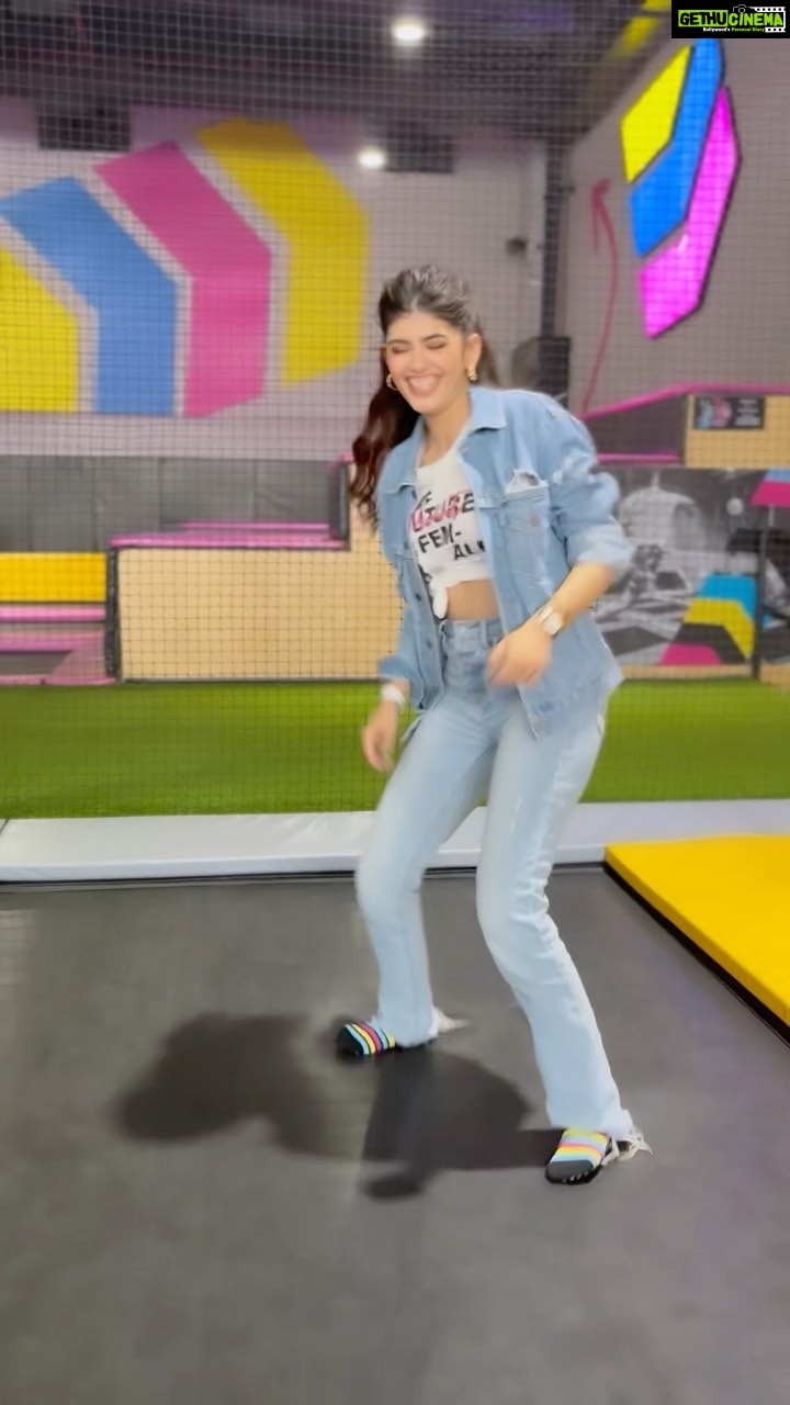Sanjana Sanghi Instagram - When a song from your film starts blasting at a trampoline park? YOU DANCE! Why was I at a trampoline park at 25 years of age? Do not ask.🤦🏻♀️ Love y’all for the love despite all my idiocies. Jokes apart - OM’s Digital World Premiere is on 11th August only on @zee5 🤎