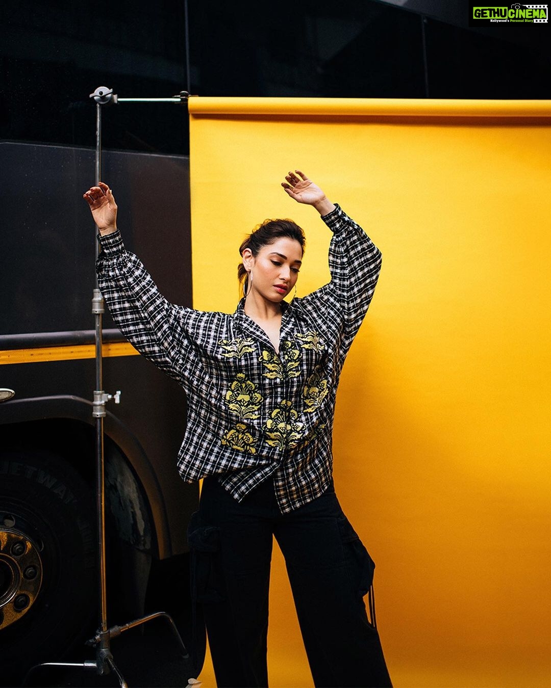 Tamannaah Instagram - Being expressive... being chic... being #BabliBouncer... isn't this androgynous look a vibe, guys? 💛 P. S. Whoever said boys shouldn't wear pink haven't seen @kapilsharma in a hot pink pullover. He was a whole mood on the sets of #TheKapilSharmaShow 💯 Keep defying the usual, Kapil 🙌🏼 Stylist: @stylebyami assisted by @anoooooshka Outfit: @dhruvkapoor Jewellery: @inezeofficial Hair: @hairbyseema Makeup: @meghnabutanihairandmakeup Shot by: @bharat_rawail