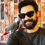 Tovino Thomas Instagram - Made a new friend in Jordan ! ‘Abud’ the African Grey Parrot !! #africangreyparrot ##Madaba #jordan Madaba مادبا