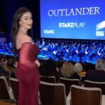 Amber Doig Thorne Instagram – The Category Is: Match Your Dress To the Red Carpet 🤣 Swipe for more BTS from the Outlander Season 6 World Premiere 😍 

Droughtlander is officially OVER 😂 Who’s your favourite Outlander cast member? 🏴󠁧󠁢󠁳󠁣󠁴󠁿🏴󠁧󠁢󠁥󠁮󠁧󠁿 Sam Heughan is so lovely in person 😍

I had such an incredible evening at the Outlander Season 6 World Premiere! 🏴󠁧󠁢󠁳󠁣󠁴󠁿 

We watched the first episode, accompanied by a live performance from the Philharmonia Orchestra! 🎵🎻 And you can watch Season 6 exclusively on #STARZPLAY from 6th March!! 🥰

#Outlander #MOREOutlander @starzplayuk @starz @outlander #outlanderpremiere #droughtlander #outlander6 #outlanderseason6 #premiere #londonpremiere #upcomingshow #upcomingseries  #samheughan  #droughtlander #caitrionabalfe #sophieskelton #outlander #outlanderstarz #outlanderseries #outlandercast #outlanderfans #outlanderseason5 #outlanderseason6 #outlanderobsessed #outlanderlovers 
#outlanderedit #outlanderfan #outlanderbts #outlander_starz ᴬᴰ