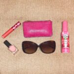 Amber Doig Thorne Instagram - A girls handbag holds MANY essential items... swipe right to see what’s in mine 🥰👜💞 What’s in your bag? 🤔 #ad #vipoo @airwickuk York Designer Outlet