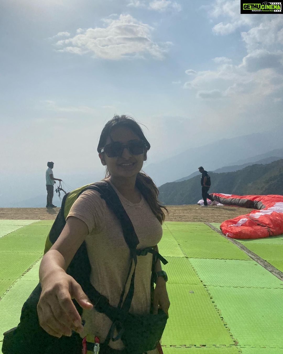 Esther Anil Instagram - π Sky above and a beautiful valley below βοΈππ Jumped from a mountain, world's second highest paragliding point towering at 8,000ft and wohoo!! Cried a little inside (maybe a little outside too π) but it was all worth it. β
οΈβ₯οΈ Second picture says it allβ¦ Eeeee.. cus nervous and excited ππΊπ½ π Bir Billing #Paragliding #BirBilling #traveljournal