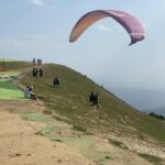 Esther Anil Instagram - 📝 Sky above and a beautiful valley below ☁️🍃🏔 Jumped from a mountain, world's second highest paragliding point towering at 8,000ft and wohoo!! Cried a little inside (maybe a little outside too 😂) but it was all worth it. ⛅️♥️ Second picture says it all… Eeeee.. cus nervous and excited 😆🕺🏽 📍 Bir Billing #Paragliding #BirBilling #traveljournal
