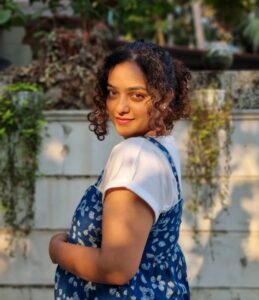 Nithya Menen Instagram - NORA 🤎 🌸 !  Pregnancy never looked cuter ... 🥹 
📷 @grgcsabu  @wonderwomenfilm
I absolutely LOVED and had sooo much fun playing Nora ... will be sharing lots of adorable pictures from behind the scenes . 
Note : I am not REALLY pregnant.