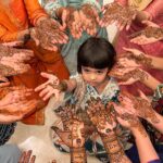 Sanjjanaa Instagram - It was so much fun to be having a mehendi party at home along with my relatives & having the best mehendi artist of banglore city in my home @ayesha_mehandi_artist .. Also do observe how beautiful my mehendi was done , it’s apparently called “ Figure mehendi “ has the name of my husband , my son carved on my hand along with a beautiful image of Shree krishna Bhagwan nurtured by Yashoda maiyaaaa which is so heart touching .. ❤️ Karnataka, Bangalore