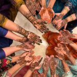 Sanjjanaa Instagram - It was so much fun to be having a mehendi party at home along with my relatives & having the best mehendi artist of banglore city in my home @ayesha_mehandi_artist .. Also do observe how beautiful my mehendi was done , it’s apparently called “ Figure mehendi “ has the name of my husband , my son carved on my hand along with a beautiful image of Shree krishna Bhagwan nurtured by Yashoda maiyaaaa which is so heart touching .. ❤️ Karnataka, Bangalore