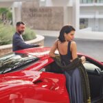 Scarlett Mellish Wilson Instagram - “I do suit red after all “ .. @grandhotelbrionipula Shoot life with @amirtabrizi @sourcemodels Hair and make up @jenniferjanemua #shootlife #luxurytravelgirl #luxuryhotels #sourcemodels #model #croatia #work #love #ferrari #red