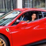 Scarlett Mellish Wilson Instagram - “I do suit red after all “ .. @grandhotelbrionipula Shoot life with @amirtabrizi @sourcemodels Hair and make up @jenniferjanemua #shootlife #luxurytravelgirl #luxuryhotels #sourcemodels #model #croatia #work #love #ferrari #red