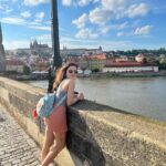 Shirley Setia Instagram - Out & about at the Charles Bridge & John Lennon Wall in #Prague 💛 #shirleytravels #travel #shirleysetia #czechrepublic Prague, Czech Republic