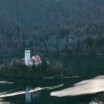 Tina Desai Instagram – Castle Bled on the cliff, and the Assumption of Maria church on a little island on the famous Lake Bled (accessible by lil boats), wrapped around by the Julian Alps.😍😍😍
#slovenia🇸🇮