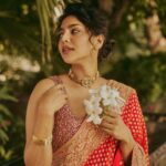 Aishwarya Lekshmi Instagram - Moments before the flyaway hair got into my nose 🤓 Sexy much ? Photographed by : @arifminhaz Styled by : @styledbysmiji Saree : @geethikakanumilli Accessories: @osvagindia Hair : @ganesh_hair_architect