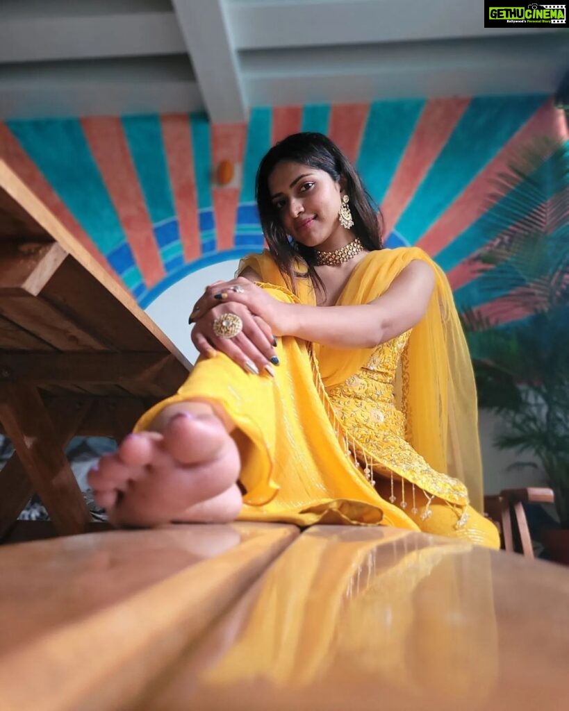 Amala Paul Instagram - Carrying a bit of sunshine with me. 🌞🌻 Outfit: @t.and.msignature Tight hugs dear Tiya for the outfit! 🤗👗 Jewellery: @m.o.dsignature 💍💎 #ootd #athome #sunshine #yellow #indianootd #ethnic #amalapaul Home Sweet Home