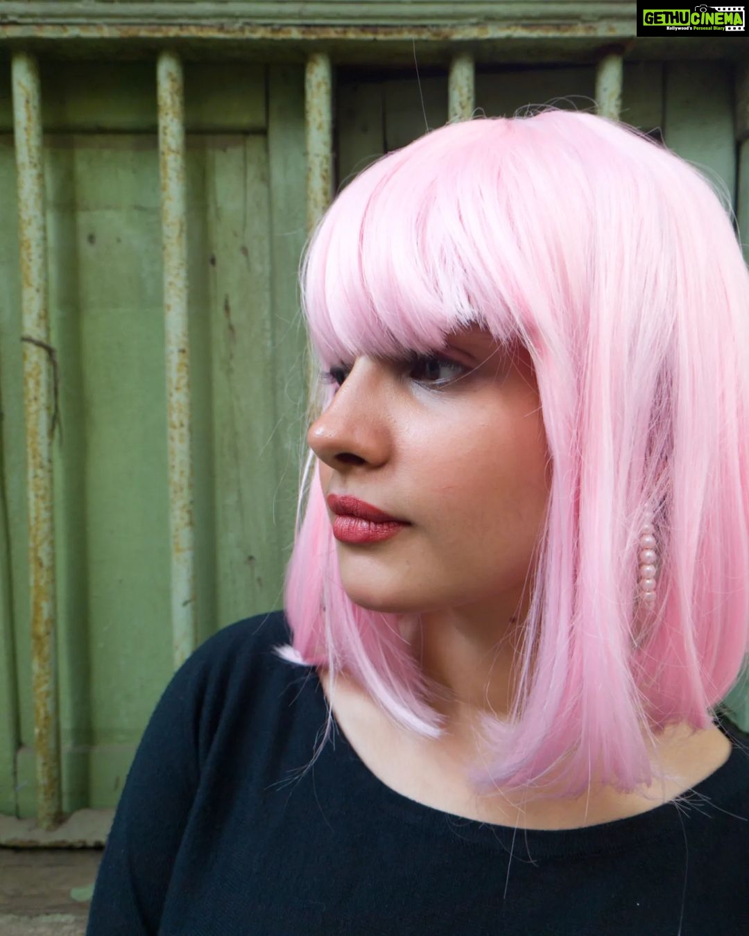 Angana Roy Instagram - Imma call her Candace. Picture and wig courtesy @nehasharmma :P 💜 Beautiful hoop earrings by @rubibyritika #candyflosshair #candace #pinkwig #aesthetic #artsy #wednesdayvibes #wednesdaypost #wigs #funk #oldwindows #igfashion #randomclick #chic #sorandom #blackpink #windows #pinkhair #candyshop #catsofinstagram #kolkatagram #haircolor