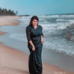 Ansiba Hassan Instagram - Footprints on the sand 🖤 . . . PC @_story_telle__r mua @_arya_jithins_makeover styling @ebsha_store #ansibahassan #actress #blacksaree #beachshoot #kollywood #tamil