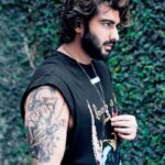 Arjun Kapoor Instagram - For me, tattoos are a form of expression and I love it! It’s cool, sexy, beautiful and I dig it. I have always wanted to sport tattoos in my films and it is not a secret that I love tattoos deeply. For me, they are always personal. I’m always hunting for cool designs and talking to people about what my next one will be. So, Ek Villain Returns was an amazing project for me because I got to sport such insane tattoos that define my character and personality in the film. Getting inked holds a different meaning for everyone, for me it was always about imprinting a part of your soul on to your body. With this film, I can safely say that I have been reunited with my love for body art and I thank Mohit Suri for covering me with tattoos that I will cherish forever. I already have 3 tattoos. Time to maybe get 1 more.