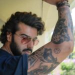 Arjun Kapoor Instagram - For me, tattoos are a form of expression and I love it! It’s cool, sexy, beautiful and I dig it. I have always wanted to sport tattoos in my films and it is not a secret that I love tattoos deeply. For me, they are always personal. I’m always hunting for cool designs and talking to people about what my next one will be. So, Ek Villain Returns was an amazing project for me because I got to sport such insane tattoos that define my character and personality in the film. Getting inked holds a different meaning for everyone, for me it was always about imprinting a part of your soul on to your body. With this film, I can safely say that I have been reunited with my love for body art and I thank Mohit Suri for covering me with tattoos that I will cherish forever. I already have 3 tattoos. Time to maybe get 1 more.