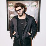 Arjun Kapoor Instagram - Black isn't my favourite colour, but don't trust me, I am a villain. 😉 Styled by: @rahulvijay1988 Photographed by: @leroifoto Jacket, knit: @rishtabyarjunsaluja Assisted by (styling): @robertson_lyngdoh_ Make-up: @vickybanatkar Hair: @bashirsayyed.hair