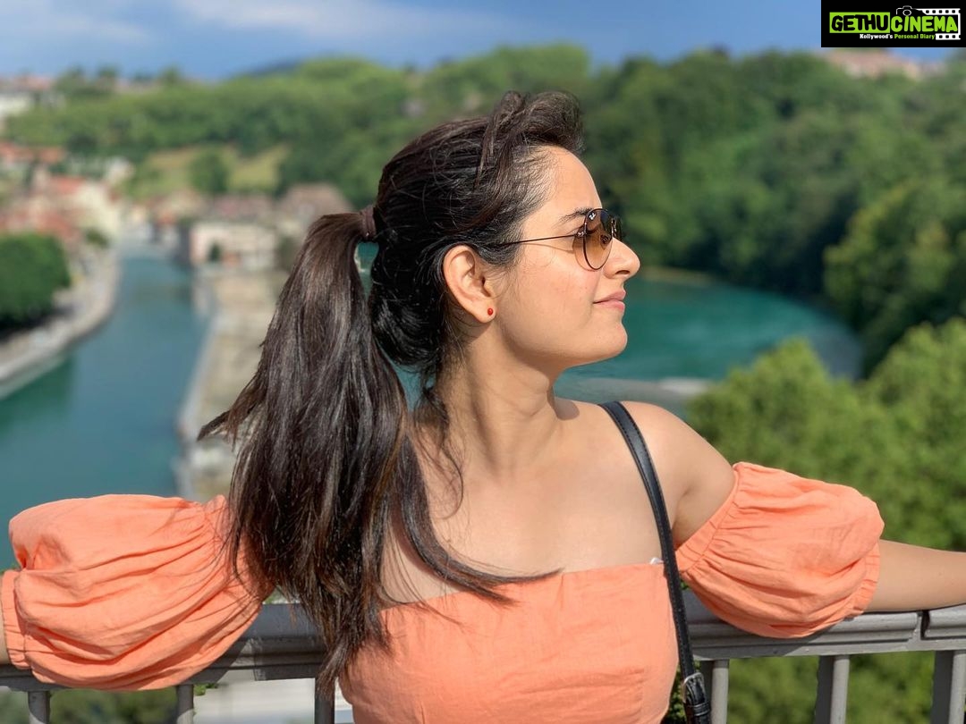 Ashika Ranganath Instagram - Bliss 🌈☁️☘️ Last from this series.. Sorry for bothering you with so many pictures 🙈 #Bern #switzerland Kirchenfeldbrücke