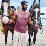 Ashwin Kakumanu Instagram - Sendhan and Semban. As part of Ponniyin Selvan, actors who came into contact with horses in scenes were sent for horseriding training by @madrastalkies . I learnt for a few weeks at the @madrasschoolof under the guidance of Alagesan master @alagesan.horse who quickly brought me into speed with their course. It was one part of my preparation since the character was involved in a horse chase scene with #vandhiyathevan as they escape from the #pazhavetturayar 's padaiveerargal/army . Ultimately the horse chase didnt make it into the film but it was so fun picking up a new skill! Thanks to Alagesan master and @madrasschoolof for giving the confidence to safely mount,ride and be around these beautiful horses. @lyca_productions #ponniyinselvan #ps1 #shootdiaries #actor #sendhanamudhan #sendhan #pookaaran #ashwinkakumanu #horseriding #horse #madrasschoolofequitation #equestrian