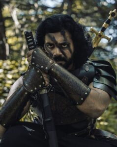 Ashwin Kakumanu Instagram - I wanted to shoot a series of photos recreating the spirit of iconic films/genres/roles that made an impression on me. As a movie fan, as a cosplay geek, and a photography enthusiast, this is my tribute to the images I love.

My #CinemaSpirit series. 

I've loved the period/fantasy genre; Gladiator, Robin Hood, Lord of the rings, and Game of thrones. Couldn't resist coming up with some images inspired by them. 

P.S: Finally lucked out in acting in a period film for real this year - Ponniyin Selvan. Here's to manifesting for more.

#ponniyinselvan #Robinhood #gladiator #LoTR #lordoftherings #GoT #gameofthrones #thelastsamurai #aayirathiloruvan #fantasy #manifest #dressforthejobyouwant #cosplay #epic #period #dressup #actor#essence #spirit #photography #camo #armor #midieval #warrior #katana #sword #editorial #ashwinkakumanu

@manavalanandco