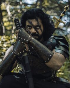 Ashwin Kakumanu Instagram - I wanted to shoot a series of photos recreating the spirit of iconic films/genres/roles that made an impression on me. As a movie fan, as a cosplay geek, and a photography enthusiast, this is my tribute to the images I love.

My #CinemaSpirit series. 

I've loved the period/fantasy genre; Gladiator, Robin Hood, Lord of the rings, and Game of thrones. Couldn't resist coming up with some images inspired by them. 

P.S: Finally lucked out in acting in a period film for real this year - Ponniyin Selvan. Here's to manifesting for more.

#ponniyinselvan #Robinhood #gladiator #LoTR #lordoftherings #GoT #gameofthrones #thelastsamurai #aayirathiloruvan #fantasy #manifest #dressforthejobyouwant #cosplay #epic #period #dressup #actor#essence #spirit #photography #camo #armor #midieval #warrior #katana #sword #editorial #ashwinkakumanu

@manavalanandco