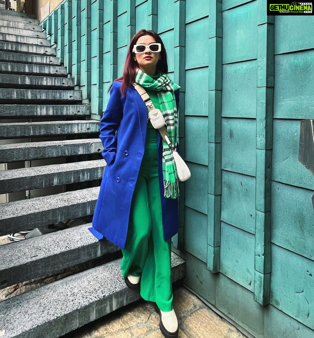 Avneet Kaur Instagram - Fashion is art and you are the canvas.💚💙 #tones #tokyo #fashion #avneetstylediaries Tee- @hm Coat- @shop.dlanxa Bag- @prada Shades- @dior Boots- @hm Styled by- @styling.your.soul Tokyo, Japan