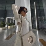 Avneet Kaur Instagram - Monochrome look on point.🤍✈️ #travel #airportlook #avneetstylediaries #styledbyme Wearing- @calvinklein Coat- @urbanic_in Jeans- @lovegen_official Bag- @gucci Boots- @louisvuitton Shades- @prada Accessories- @accessorizeindiaofficial 📸- @singhjaijeet_4 Indira Gandhi International Airport, New Delhi