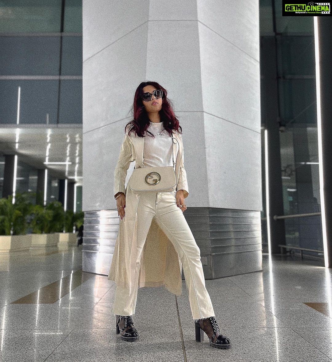 Avneet Kaur Instagram - Monochrome look on point.🤍✈️ #travel #airportlook #avneetstylediaries #styledbyme Wearing- @calvinklein Coat- @urbanic_in Jeans- @lovegen_official Bag- @gucci Boots- @louisvuitton Shades- @prada Accessories- @accessorizeindiaofficial 📸- @singhjaijeet_4 Indira Gandhi International Airport, New Delhi