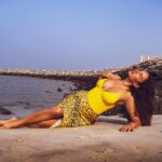 Elena Roxana Maria Fernandes Instagram - Create your own sunshine! . . . Swimsuit: @lesgirlslesboys Skirt: @kobihalperin Photographer: @munavvar_munna Earrings: @bespokebymb . #sunshine #yellow #outfit #ootd #skirt #outfitoftheday #beauty #beautiful #pretty #love #glow #glam #sunkissed #water #sea #dubai #uae #travel #shoot #shootdiaries #beach #slay
