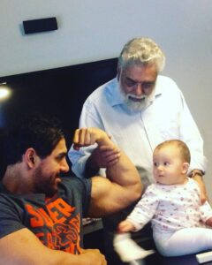 John Abraham Instagram - 👶🏽: Is his bicep bigger than my head? 😯 #throwbacktobigarmdays . . . . #johnabraham #ja #jaentertainment #fitness #lifting #neice #family #workout #strong