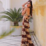Karishma Sharma Instagram - I was travelling to Udaipur and I was very short on time to go shopping. So ,I decided to make something for myself. I ended up designing an outfit and my masterji gave it the right finishing touch. Well , a lot of you asked me about this outfit , it was made by yours truly !! It made me extremely happy to know you guys loved it so much. It’s amazing to think about all of the things we were obsessed with as kids, I was obsessed with making dresses and stitching clothes for my Barbie Dolls or even some cute tops for my mum. I remember my mum asking if I was done studying for my exams before I hopped on to my grandmas old sewing machine ( I want one now ) and I would always tell her “yes mama, it’s all done” and obviously it was never done haha ! While it might feel like those interests are destined to stay in the past, it doesn’t have to be that way. Returning to the things we loved as kids can help us deal with the realities of adulthood. K.S - Keep it Simple Shot by @nikolazgodet Taj Fateh Prakash Palace