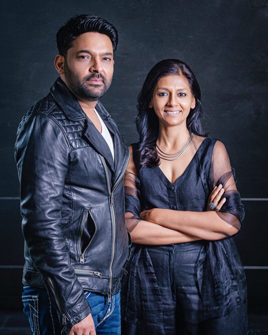 Nandita Das Instagram - Cool photos from Busan. No make up, no studio. They made @kapilsharma and me stand under a staircase in the main lobby of the theatre. Yet they managed to make us look like a Mafia Duo in Black. I could not hold that serious look for long, but the comedy king did! The article is all in Korean, but still sharing it- http://www.cine21.com/news/view/?idx=8&mag_id=101178 #zwigato @busanfilmfest the full middle photo is in the story. See what happens when you are grappling with technology!