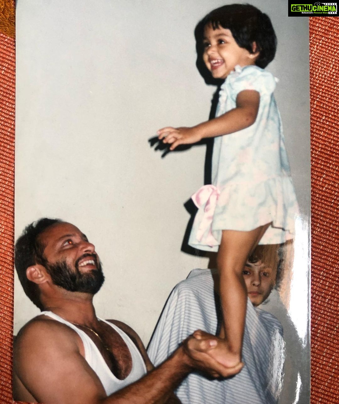 Neetha Ashok Instagram - Helping Appa with his Home workout since 1993 🤭🤣 I have no idea what @mateacher97 is doing in the background 😂 looks so funny all wrapped up in a bed sheet 😂 #quaratineworkout #daddaughterduo Kota, Kundapura