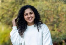 Noorin Shereef Instagram - White is not a trendy color. It’s the color of centuries of fashion! Casually chilling in White and smiling bright in the simple and stylish outfit with personalized name tag on it by @levis_in 📸 @vipin_nairs #levis #levisindia #customlevis #white Dubai, United Arab Emirates