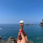 Richa Chadha Instagram - Italy photo dump! 🇮🇹 1 - post ocean swim, 2 - Aloo on streets, 3- Umberto 's Baba cake, 4- Maestro and muse, 5- City of graffiti 6- Tiny gelato 7 -Jester and Jester art . . #italy #napoli #travel #vacation #photodump
