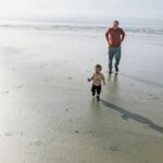 Richa Gangopadhyay Instagram - Here's another reason to add Oregon to your #bucketlist: The Oregon coast! Of the many gorgeous coastal beaches and towns in this state, one of our most frequented ones (especially when anyone comes to visit us!) is Cannon Beach 🌊. The iconic Haystack Rock 🪨 is accessible right from the beach and is an easy, 1.5 hour scenic drive from Portland metro. Cannon Beach has a quaint beach town bustling with saltwater taffy shops (with the wildest flavors!), people window shopping in charming little souvenir shops, loads of breweries, bars and restaurants surrounding a serene coastal residential area nestled in evergreens, mountains and a misty fog all year round (thanks to its own microclimate). You might get lucky on a rare sunny day, but it wouldn't be a Pacific Northwest experience without a little nip in the air! 🏔 We last brought Luca here when he was 8 months old, in a baby carrier, and now at 16 months all he wanted to do was chase his reflection in the glassy sand and fearlessly run into the ocean! Pictured: tiny human alone, dangerously close to the ocean; Not pictured: outgoing tide and 3 adults close by, constantly chasing him! 🌊 Cannon Beach never disappoints- make sure to save it for your visit out to Oregon! 💚 • • • • • #cannonbeach #oregoncoast #pacificnorthwest #pnwbeach #haystackrock #portland #oregon #oregonexplored Cannon Beach, Oregon