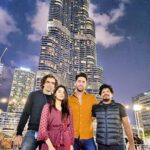 Simran Sharma Instagram - Couldn’t not share this magnificent moment!✨ (If only we all looked into the same camera...😛) #photooftheday #imtiazali #ehanbhat #ravivarman #simransharma #eyesforyou #dreamsdocometrue #opporeno5pro #dubai #burjkhalifa #dubaimall #lights #beautifulcity Burj Khalifa By Emaar