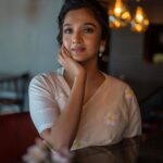Surabhi Santosh Instagram - She blooms even when darkness engulfs her 🌼 Photograher: @rajesh.natarajan Makeup: @jijo_jo_the_makeup_artist Styling: @kavithasantosh29 Saree: @inkpikle Location: @selfieteaindia, Kochi