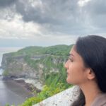 Surabhi Santosh Instagram - Uluwatu Temple was the last stop in my two week trip. It is definitely a must go! A walk through the scenic cliff during sunset just fills your soul. The cliff and sea beneath gives you a Varkala feel but the naughty and thieving monkeys will quickly make you realize that you are not in Kerala. And I’m not joking when I say that those monkeys will steal everything, from the specs resting on your head to your footwear if you leave it around, wallet and even your phone so saving your stuff from them takes a lot of effort and is an adventure in itself 😂 SWIPE LEFT #Balistories #uluwatutemple #traveltips #scenicbeauty #adventure #laughs Uluwatu Temple, Uluwatu, Bali