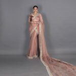 Zoya Afroz Instagram - “There is beauty in simplicity” - ✨Revealing My National costume ✨ The inspiration for the national costume comes from 19th century INDIA paintings … these royal figures often were draped in translucent silk and were more often draped along with jewellery made of pearls . Taking inspiration from these elements we created a national costume that is ethereal and other worldly . These Mughal era paintings depict elegance which has been translated in the pre draped saree made entirely of silk organza and hand embroidery of pearls and mirror work . Traditional Indian costumes are often given the stereotype of bright colours but there is an era where importance was given to simplicity and elegance . Designer : @officialsaishashinde Photography : @studiodenz Makeup : @sunita_dindi Hair : @ishwaribarla Styled by : @lakhanisana Jwellery by : @srishringarr
