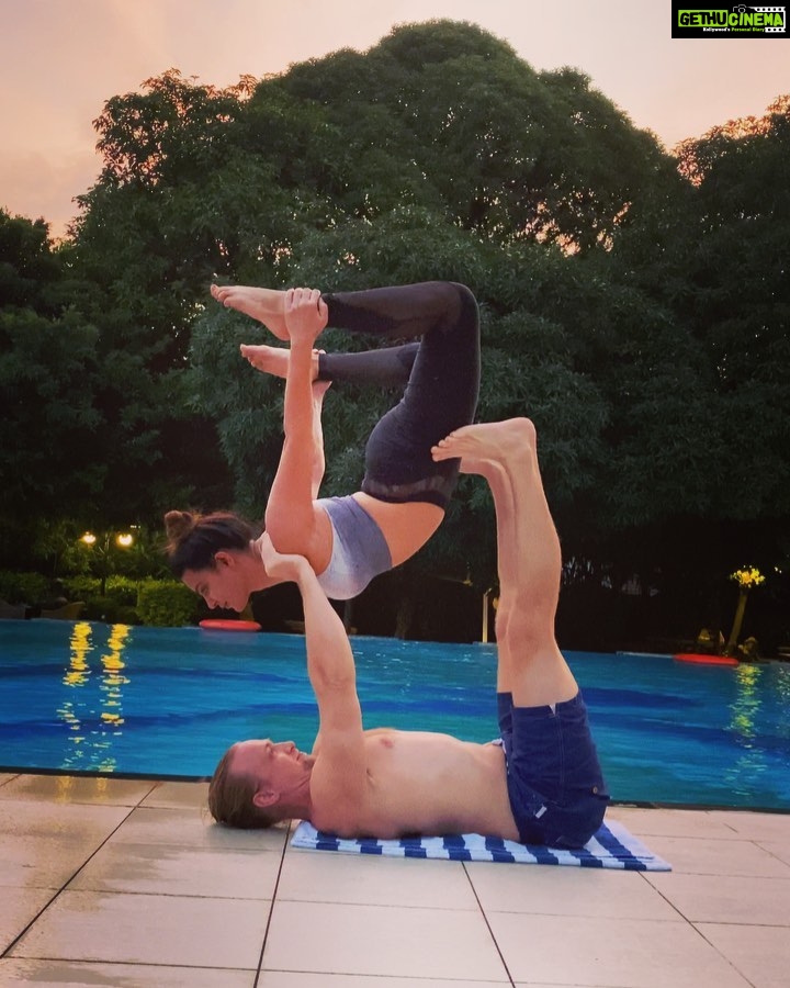 Aashka Goradia Instagram - I get to fly when he is around... ✨ @ibrentgoble Simply being. . . . . . . . #acroyoga #yoga #yogaforlife #ashtanga #hatha #yogaonline #yogashala #staycation #poolside