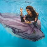Aashka Goradia Instagram - A song - A story - A dance . . . This is certainly going up on the wall to remind me that there is always a perfect moment after a storm and so let the storm pass while you keep a warrior heart. With the dress that intertwined - hair that came on the face - the delusion of drowning (most fears are delusions, self imposed) to aspirating and chills of the water. My husband stayed on top and kept reminding me to stay calm and then the moment of this perfect shot (least to me) The photographer’s patience and my struggle - boom 💥 Will most certainly do this again and again and will get better at it. . . . . . . . . #underwater #underphotography #love #photography #water #myfear #mycalm