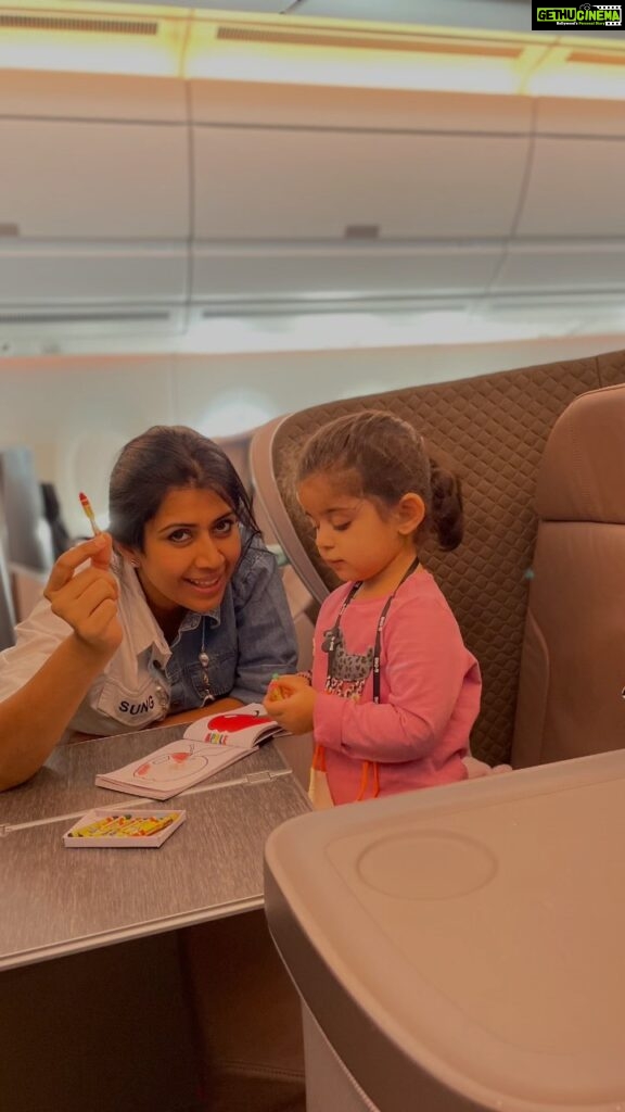 Ankita Bhargava Patel Instagram - Travelling with a toddler in a long-ish flight ! ✈️ Herez what All i did- ➡️I prepared a busy bag full of some new and some old activities. ➡️The evergreen Magnetic scribble board is a life saver. ➡️Got a new pop up book for the surprise element. ➡️Crayons,Stickers,Stamps and a drawing/colouring book are a must. ➡️We made Some pasta bracelets too. ➡️Her first official screen time happened on this flight! ➡️She got amused with the whole idea of using headphones. However after 15 mins she didnt care much about what was going on on the screen. ➡️I made a small suitcase with extra set of clothes for both Mehr and myself. ➡️Her fav doll and fav blanket to give her company. ➡️The flight was fairly empty so she walked around and explored the entire aircraft. ➡️I made sure i gave her her fav snacks to munch on and sips of water while take off and landing to help ear pressure. ➡️Pre ordered a kids veg meal while booking our tickets. ➡️She feeds herself so it was fairly easy for me on flight. ➡️She got comfy with eating slightly spicy foods on this trip. ➡️Kept her well hydrated thru the flight. ➡️I showed her ‘Happy Feet’ as her 1st film also cos we were about to visit penguins in Singapore so that she cud relate to them better. ➡️She also interacted with a senior couple sitting behind us who were amazed at how much she talks! ➡️Lots of cuddles and Loving too ! ➡️Little nap too Over all both the journeys to and fro were as smooth as butter ❤️ P.S - Plz make sure all the vaccinations of your child are up to date.I got Mehr her Influenza shot a few days before travelling.