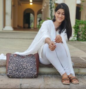 Deeksha Joshi Instagram - 2023 is going to be the year of healing and happiness. 🌱✨ Thank you @zoukonline for such a pretty bag and footwear!