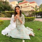 Eisha Singh Instagram - Secret conversations between the trees and sky, hums a tune of peace in my heart.🌻 . . . Adding green to my garden in this beautiful outfit by @roze.india ♥️ Juttis: @saya.india