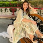Eisha Singh Instagram - Secret conversations between the trees and sky, hums a tune of peace in my heart.🌻 . . . Adding green to my garden in this beautiful outfit by @roze.india ♥️ Juttis: @saya.india