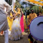 Esha Kansara Instagram - Never knew our families loved dancing THIS MUCH! 😍🥰🥳💛 🥳🤭💛 @musicwaala Photography @karmaproduction_india 🌸 Outfit @picchika Jewellery @vaidaan.official HMU? No make up at all by me myself 🤪